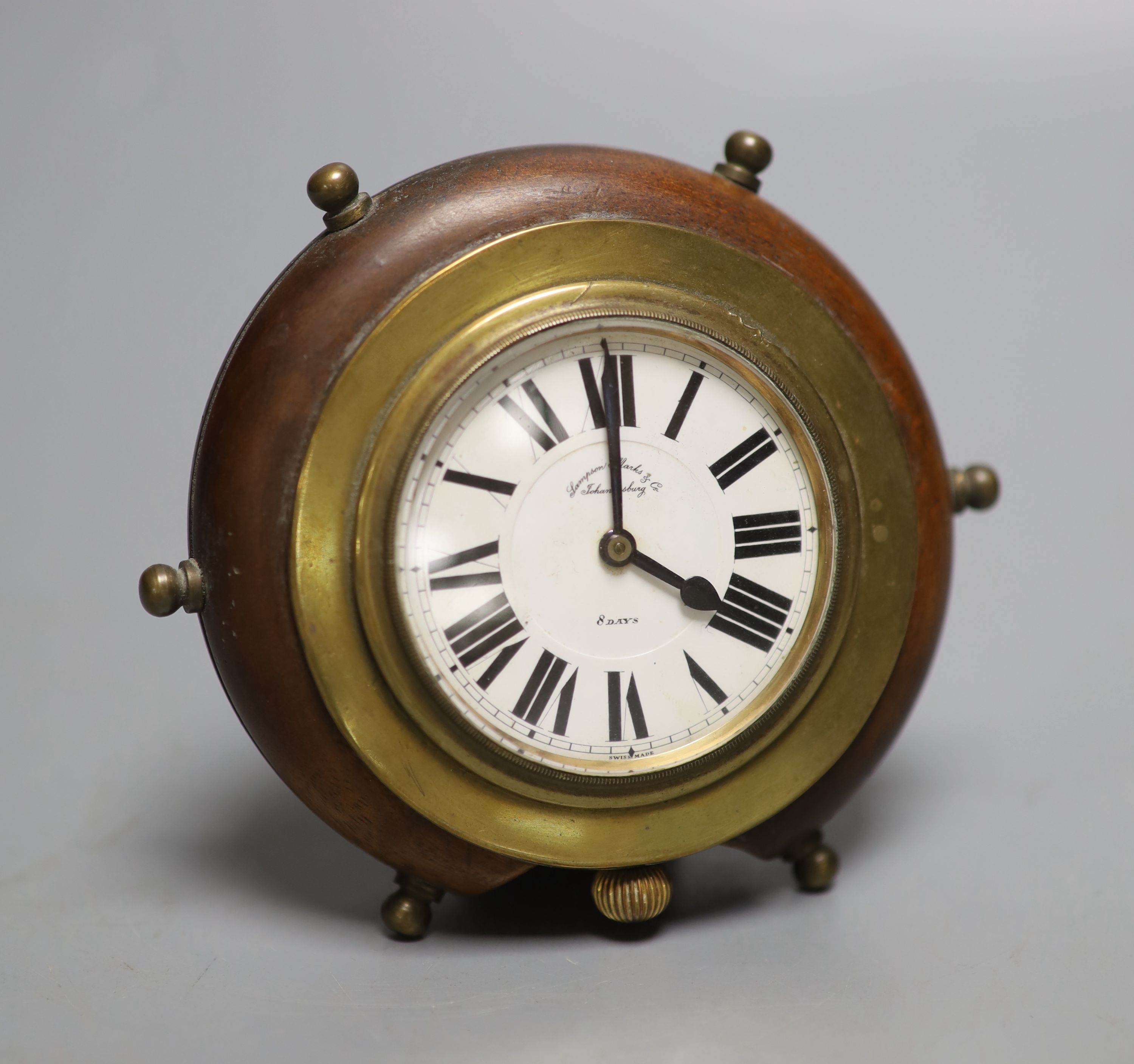 A novelty mahogany and brass framed timepiece, in the form of a ships wheel